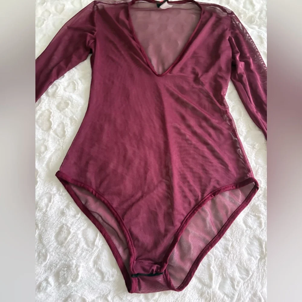 NWOT USA Vintage Burgundy Sheer Long Sleeve Bodysuit in Size Medium.